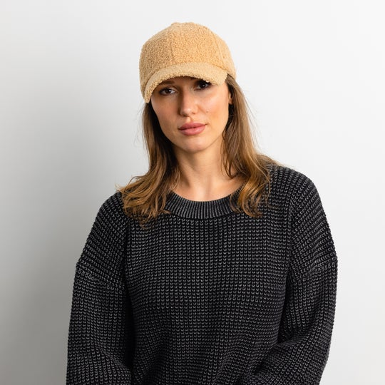 Hat Attack Grab this classic shaped baseball hat in a trendy sherpa fabric to stay stylish and chic everyday this fall. Choose from natural or black!