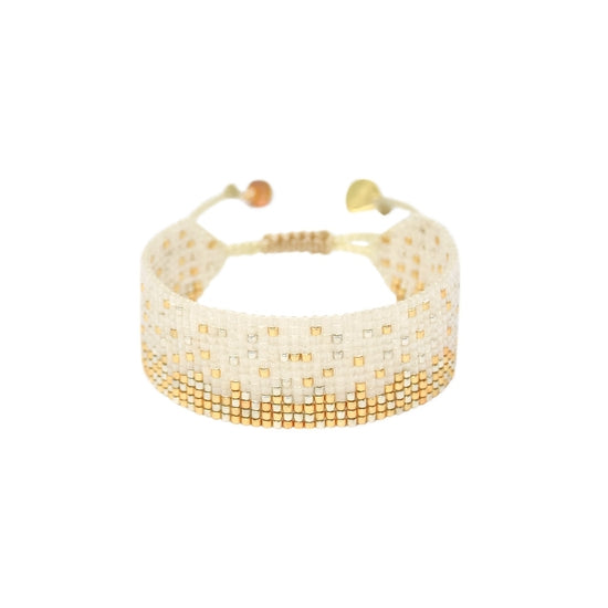 This handcrafted bracelet uses a pail color pallette which results in a design that is elegant, simple and super easy to pair! Dress up or dress down! To complete the look, pair with our Ella Adam and Eve Earrings! *Materials: Japanese Beads, polyester thread, gold-plated Logo